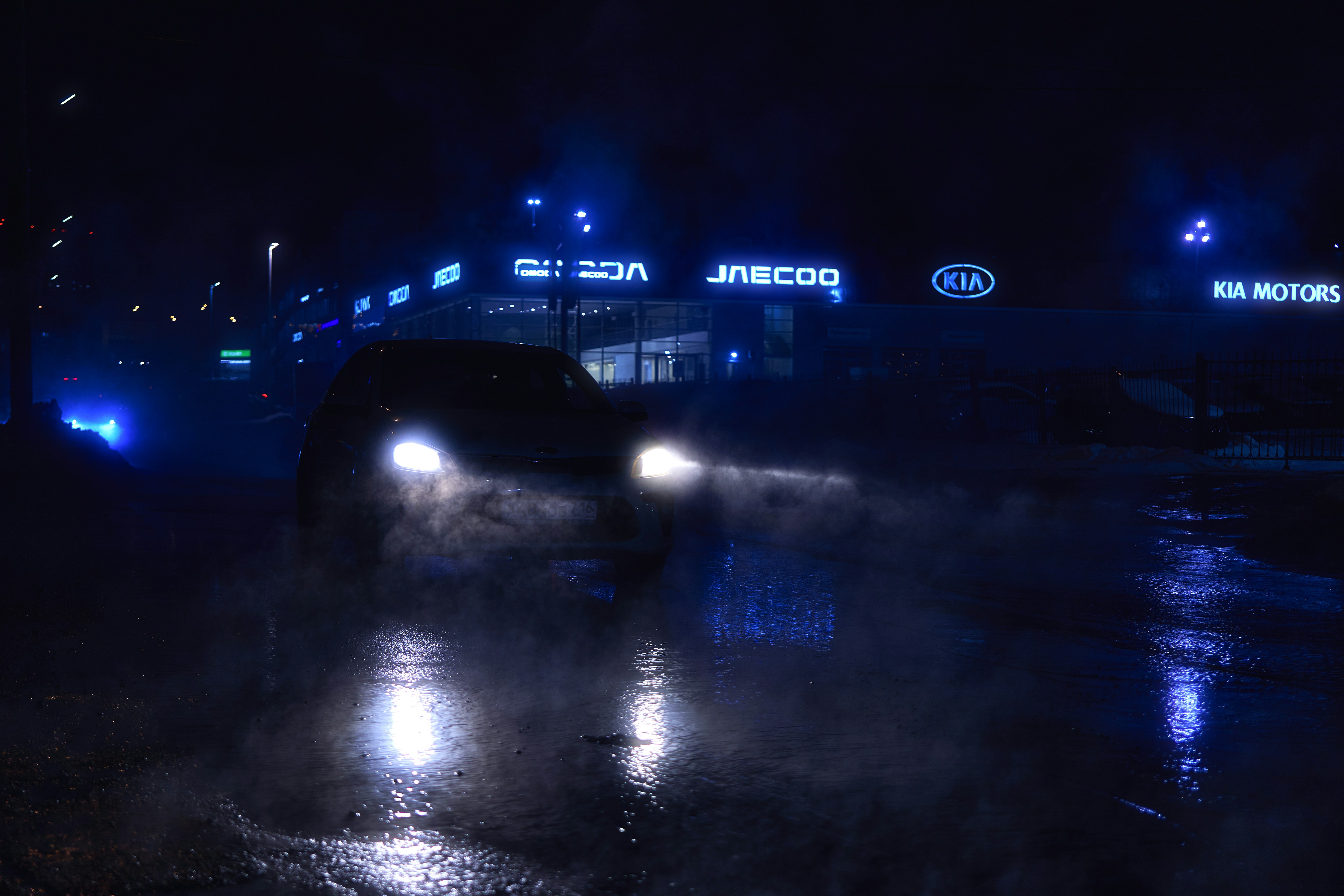 Ford F-150 Lightning electric pickup charging at a home driveway in the United States