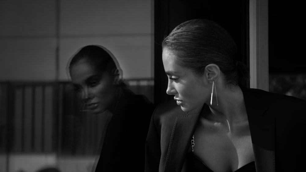 a black and white photo of two women