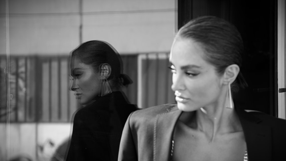 a black and white photo of two women