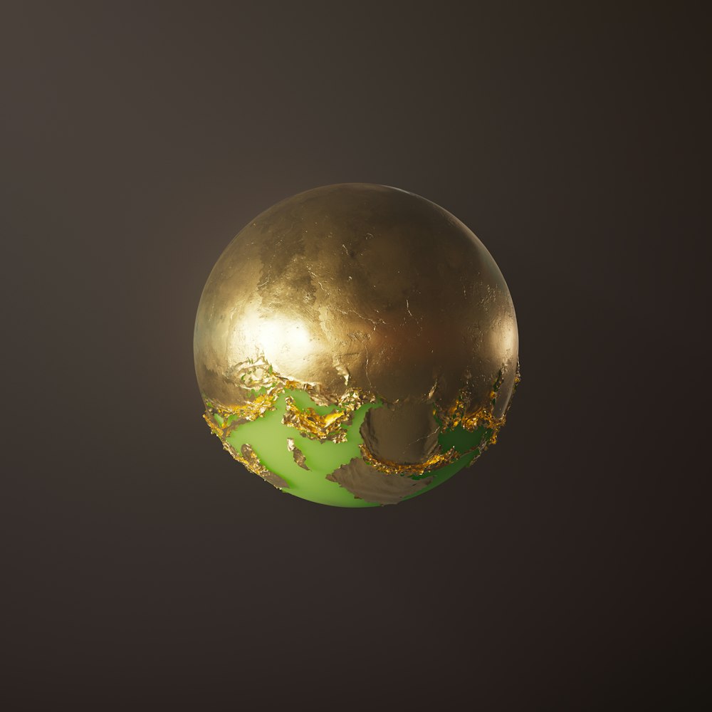 a gold and green globe on a black background
