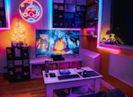a living room with a television and a game system