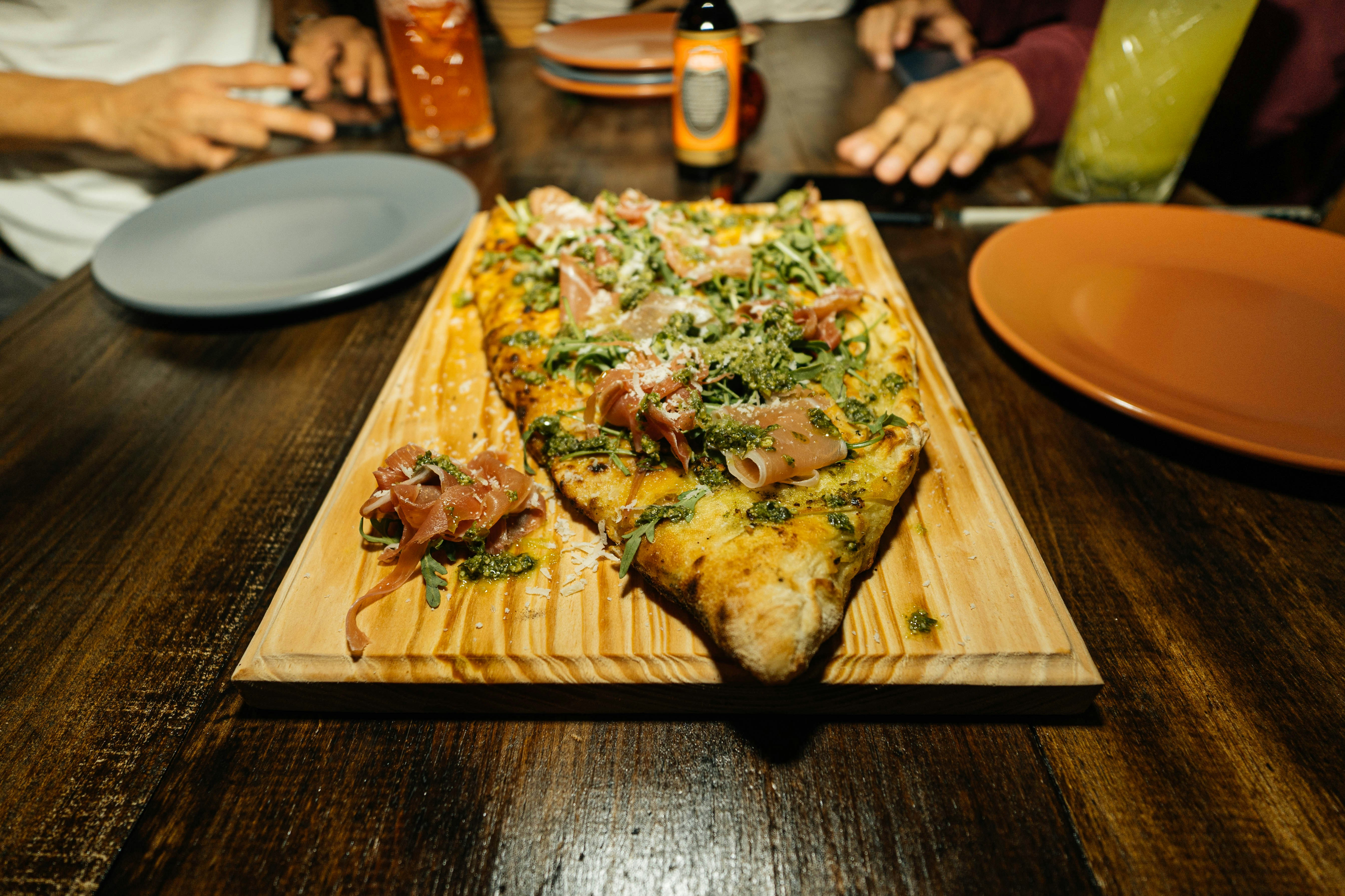 Pizza on wooden cutting board