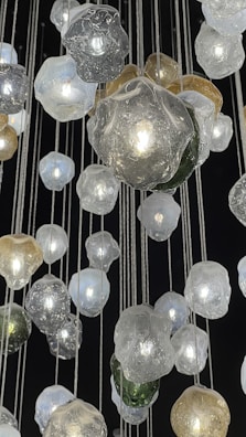 An installation piece featuring hanging glass orbs glowing gently.