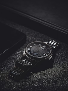 Limited-edition watch showcased with dramatic shadows and refined details.