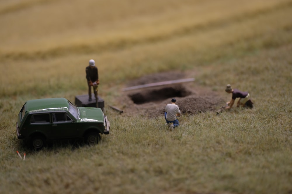 a group of people standing on top of a field