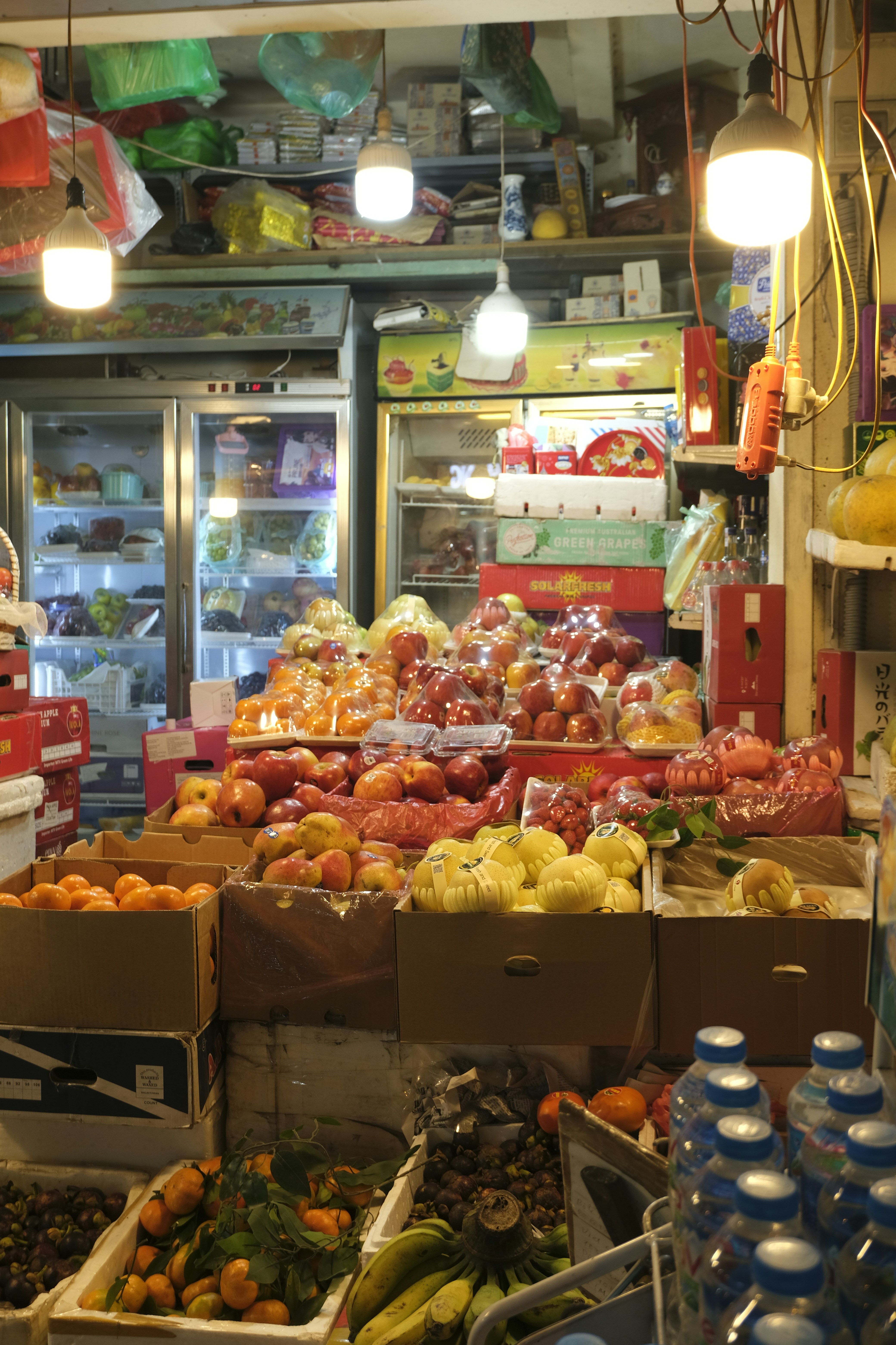 a store filled with lots of fruits and vegetables
