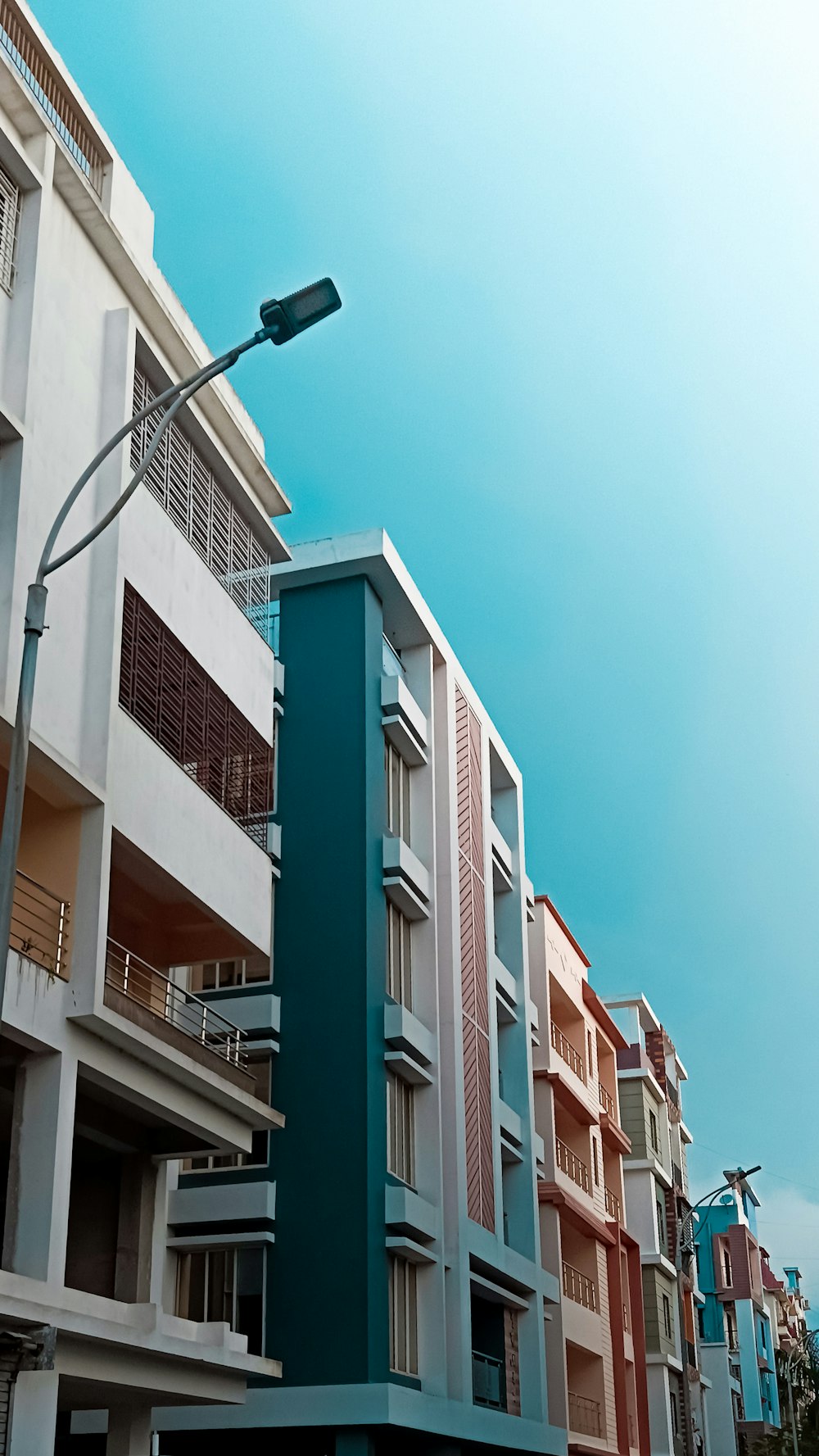 a tall building with balconies and balconies on the side of it