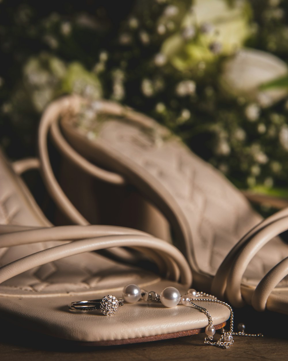 a close up of a pair of shoes and a ring