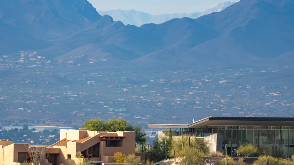 a view of a city with mountains in the background