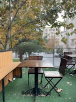 Artificial turf laid out in a commercial outdoor seating area, inviting and green.