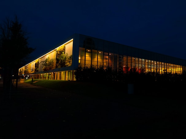 Nighttime view of a GAR Corporation building illuminated with sustainable LED lighting highlighting its iconic architecture.
