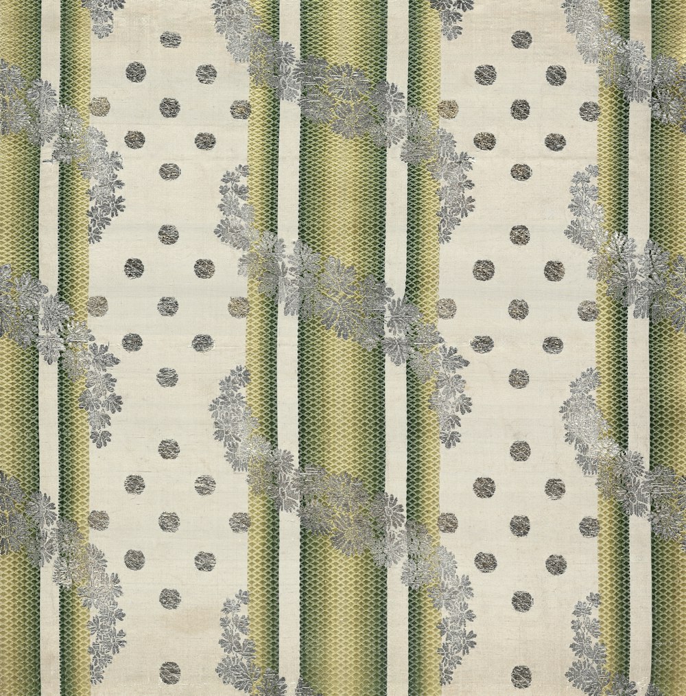 a white and green striped wallpaper with flowers
