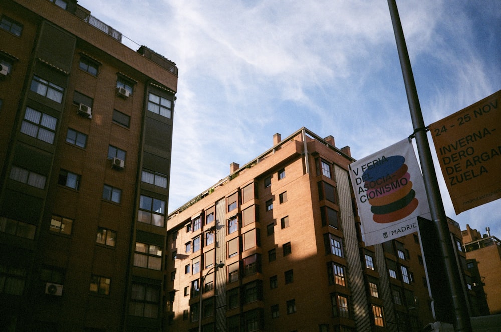 a tall brown building sitting next to a tall brown building