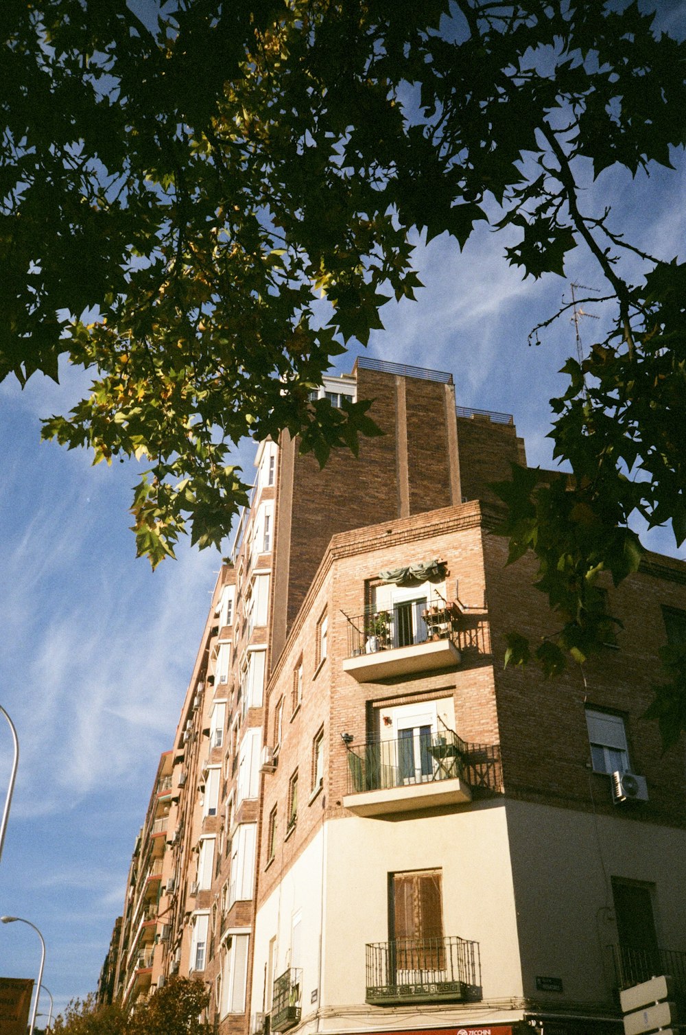 a tall building with balconies and balconies on the balconies