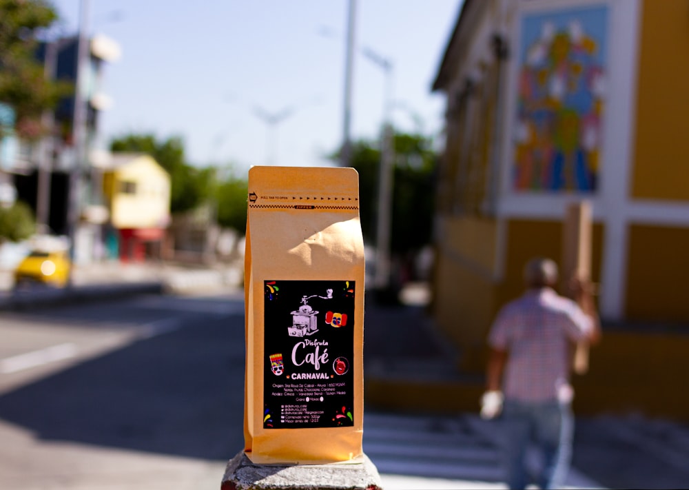 a bag of coffee sitting on the side of a road