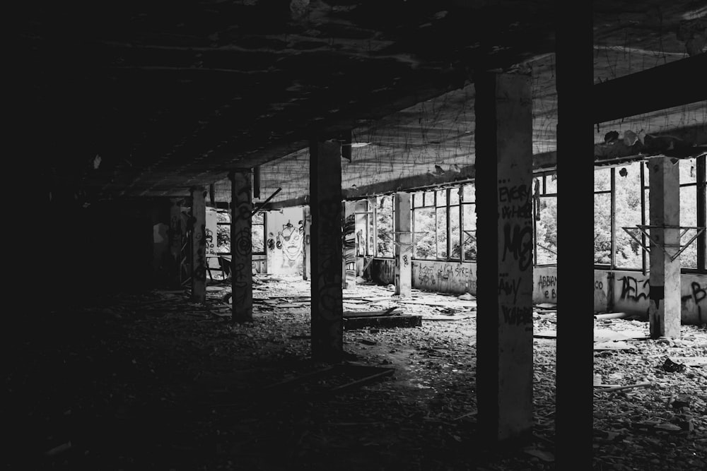 a black and white photo of an abandoned building