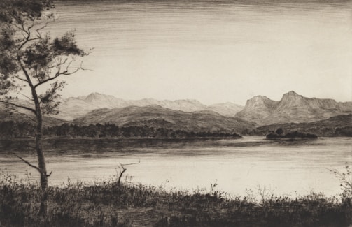 A serene landscape with a person in the foreground.