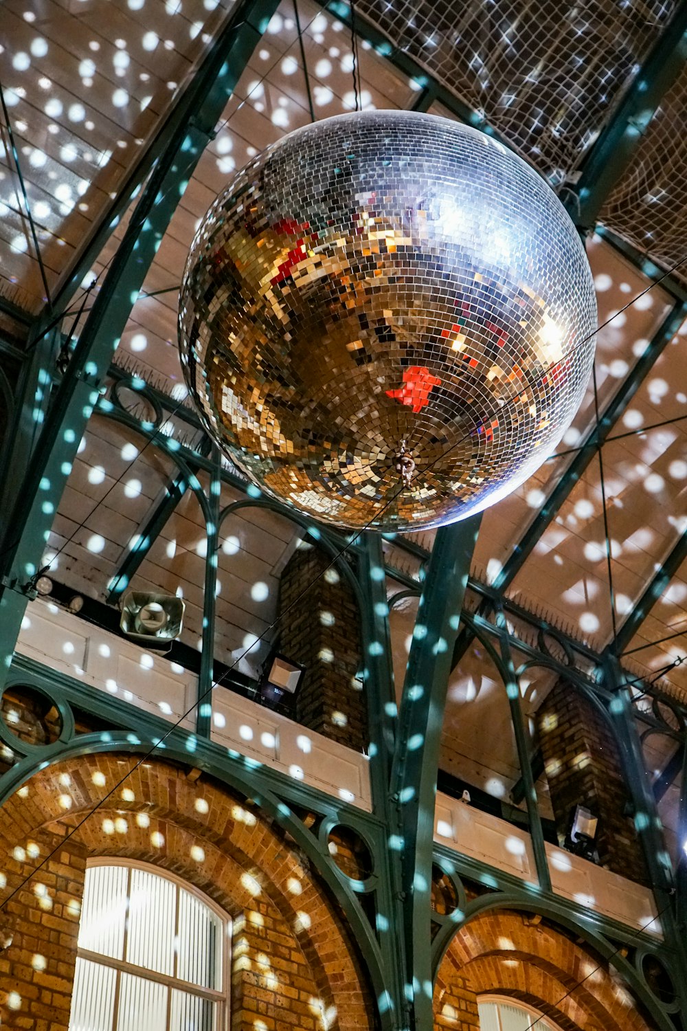 a disco ball hanging from the ceiling of a building