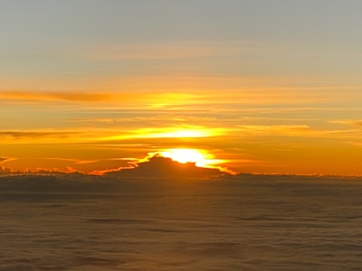 A vibrant sunrise over a musical horizon, blending white and orange colors.