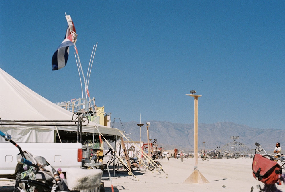 a group of motorcycles parked in front of a tent