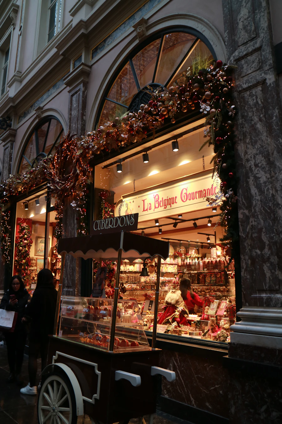 A warmly lit sweet shop storefront