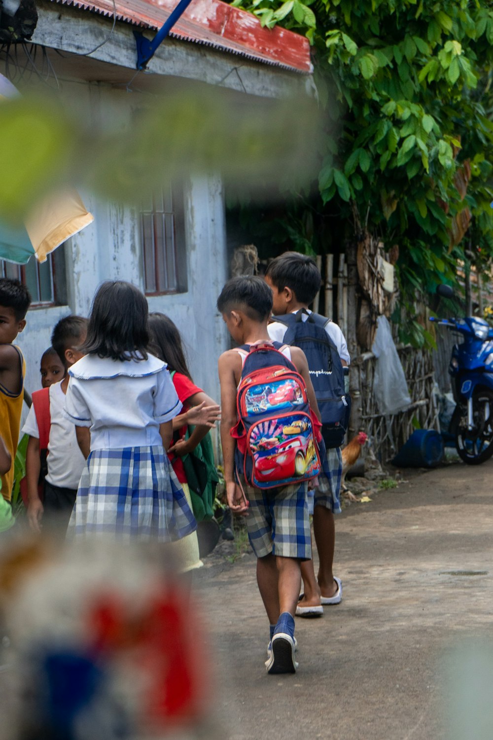 a group of children walking down a street