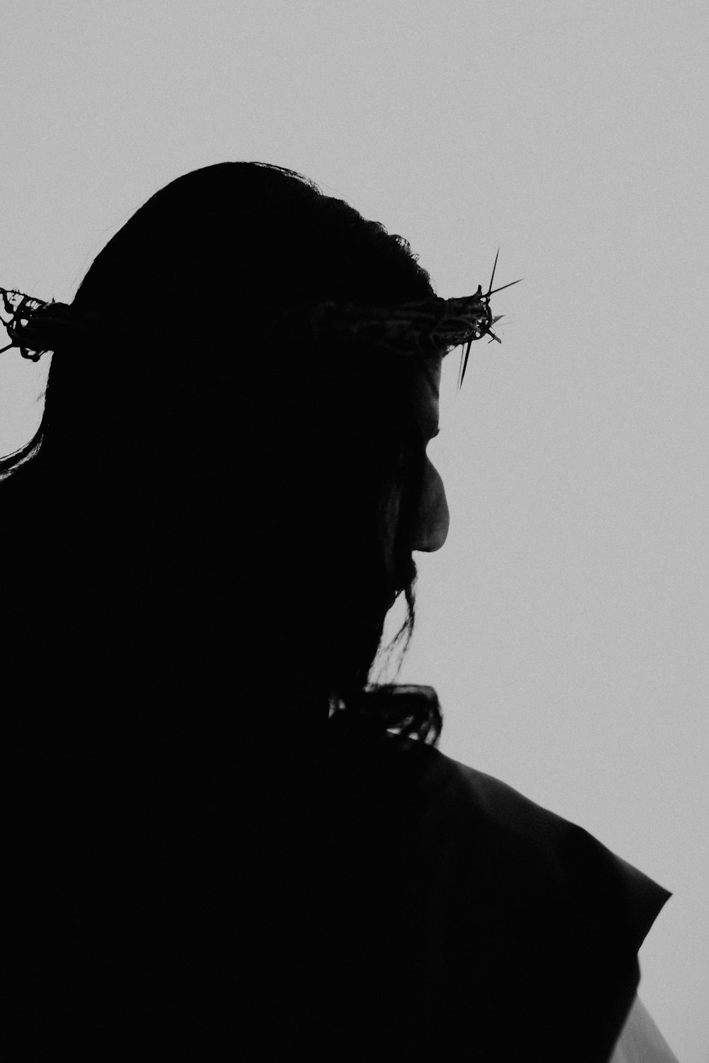 a person with a crown of thorns on their head