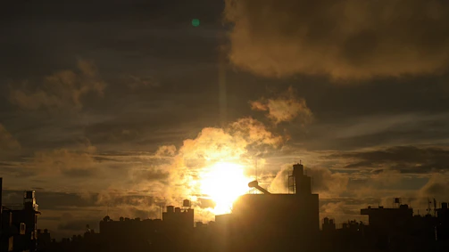 A dramatic 4K cinematic shot of an urban nightscape with golden light accents.