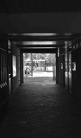 a black and white photo of a hallway