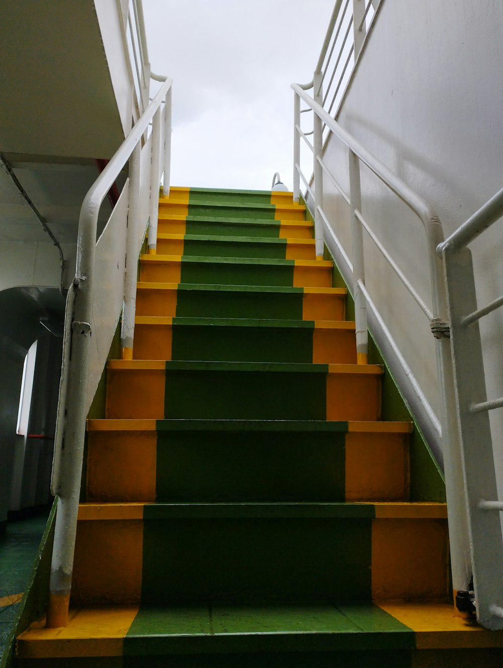 a set of stairs with yellow and green steps
