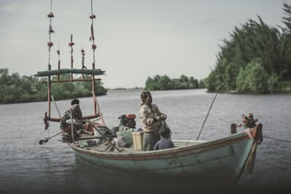 A happy family enjoying a boat ride on a calm lake.