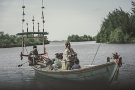 A happy family enjoying fishing together by the riverside.