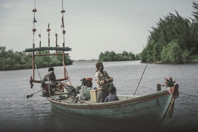 A family enjoying a day of fishing together on a boat.