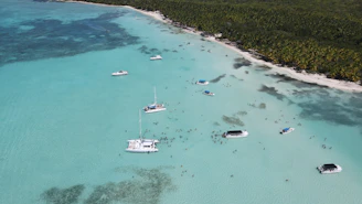 a group of boats floating on top of a body of water