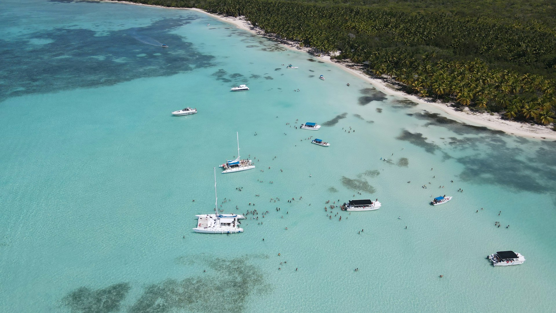 a group of boats floating on top of a body of water