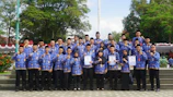 Group photo of 100 trained women proudly holding their certificates.