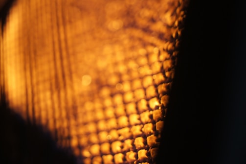 close-up of high-gsm fabric texture glowing under neon lights