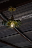 A unique lighting fixture crafted from reclaimed materials, adding charm to any space.