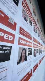 Volunteers in an American search team distributing missing children posters in a neighborhood.