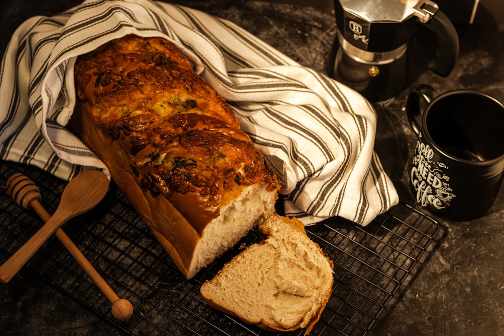 a loaf of bread sitting on top of a cooling rack