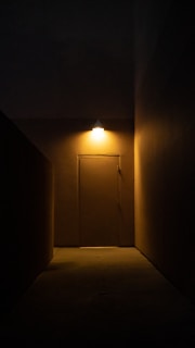 Dimly lit hallway leading to the soundproof recording booths.