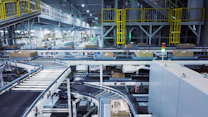 a factory filled with lots of machines and boxes