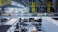 a factory filled with lots of machines and boxes