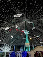 A festive outdoor event decorated with dynamic LED displays.