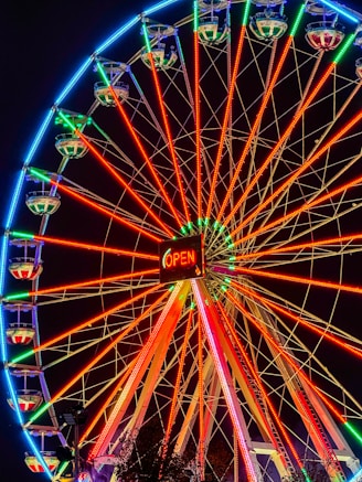 a large ferris wheel lit up at night