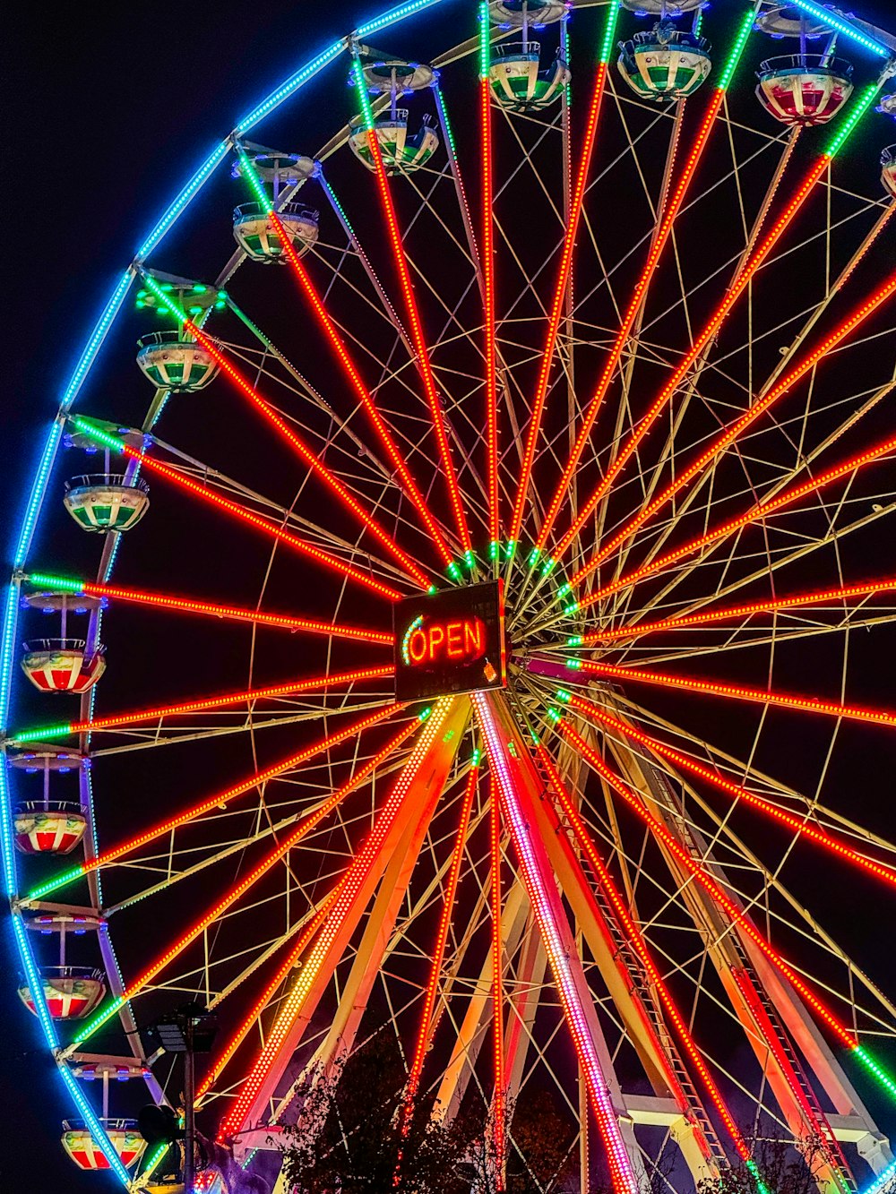 a large ferris wheel lit up at night