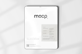 A digital mockup featuring a tablet with a minimalistic design. The screen displays a sleek interface with the word 'mocp' prominently at the top. Below it, there's information about features such as very realistic output and fully editable resolution. The background is clean and white, accented by soft shadows.