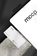 Minimalistic branding materials including business cards and stationery.