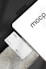 A business card with 'mocp' branding placed on a concrete surface, accompanied by a modern electronic device displaying the same text. The design is minimalist, featuring white and gray tones. A QR code is present on the card alongside the text 'Personal Brand'.