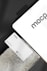 A business card with 'mocp' branding placed on a concrete surface, accompanied by a modern electronic device displaying the same text. The design is minimalist, featuring white and gray tones. A QR code is present on the card alongside the text 'Personal Brand'.